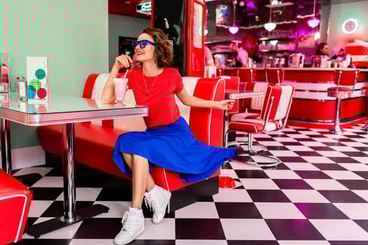stylish smiling woman in retro vintage cafe photo