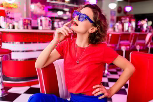 stylish smiling woman in retro vintage cafe photo