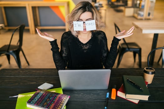 young woman working on laptop in co-working office photo