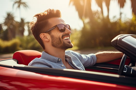 Young handsome man driving convertible car in the mountains. Side view. Generative AI photo