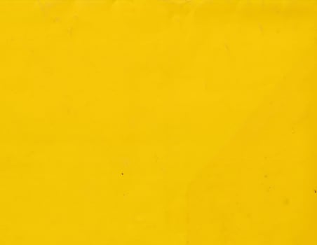 Grunge yellow plastic background template. Smooth and vibrant surface texture. photo