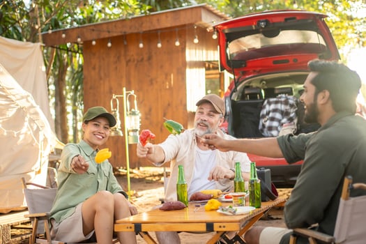 Group tourists drinking beer-alcohol and play guitar together with enjoy and happiness in Summer while camping photo