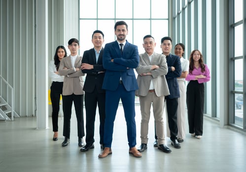 Group of business people standing in line in conference room used for meeting in modern office photo