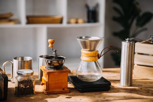 Happy young adult couple making breakfast and drinking coffee together in cozy home kitchen in morning at home. Preparing meal and smiling. Lifestyle, leisure and Love concept. photo
