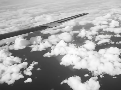 view from airplane with clouds and airplane wing AI Generative photo