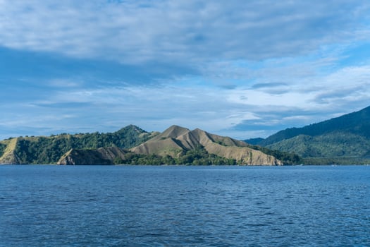 Beautiful view of Pulo Dua Balantak hill, view of blue sea and white clouds with blue sky located in the Banggai district of Central Sulawesi, Indonesia photo