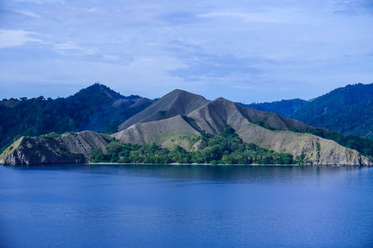 Beautiful view of Pulo Dua Balantak hill, view of blue sea and white clouds with blue sky located in the Banggai district of Central Sulawesi, Indonesia photo