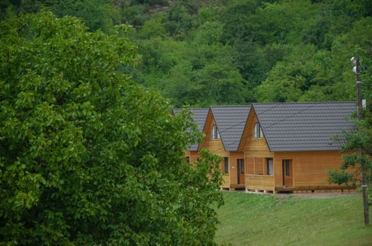 wooden houses in the middle of the forest. Camping photo