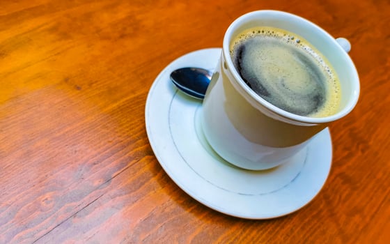 Cup of americano black coffee in restaurant Mexico. photo