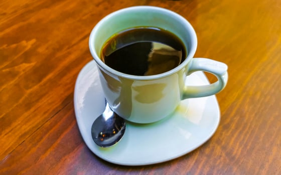 Cup of americano black coffee in restaurant Mexico. photo