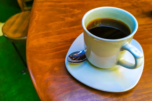 Cup of americano black coffee in restaurant Mexico. photo