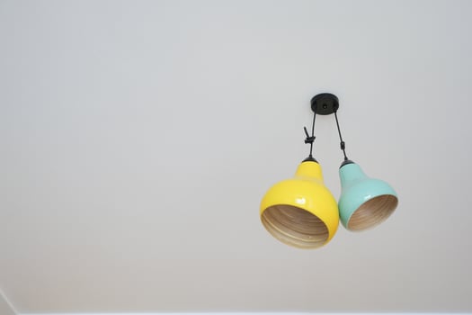 gray ceiling lamp hanging in a room , photo
