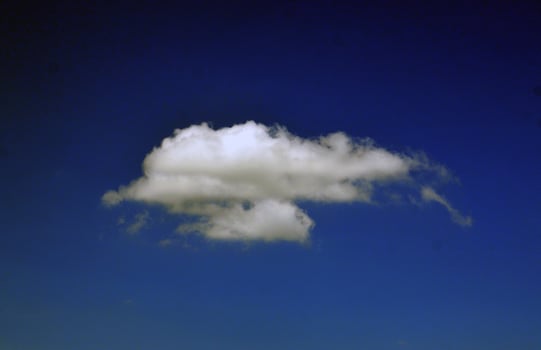White cloud isolated on a blue sky photo