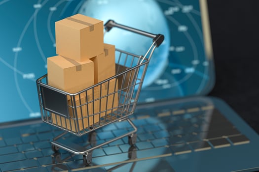 Shopping cart and laptop, online shopping concept, 3d rendering. photo