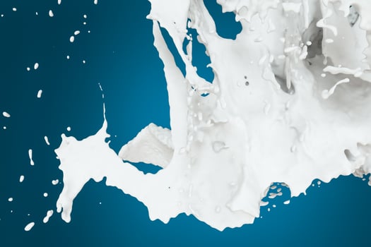 Splashing milk with blue background, 3d rendering. photo