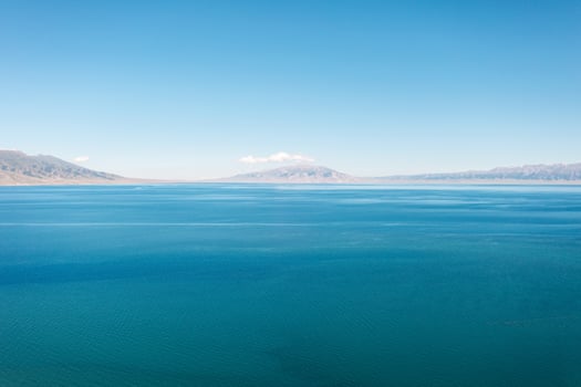 Lake and grassland with a sunny day. Shot in Sayram Lake in Xinjiang, China. photo