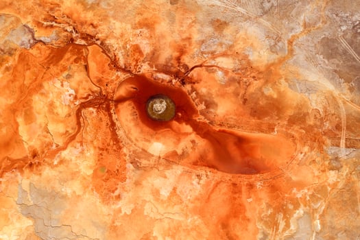 Texture of the ground with blood color, underground water. photo