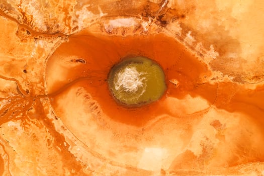 Texture of the ground with blood color, underground water. photo