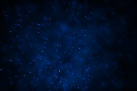 Flowing and glowing particles with dark background, 3d rendering photo