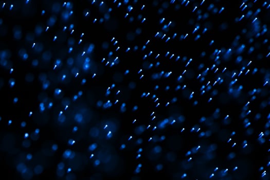 Flowing and glowing particles with dark background, 3d rendering photo