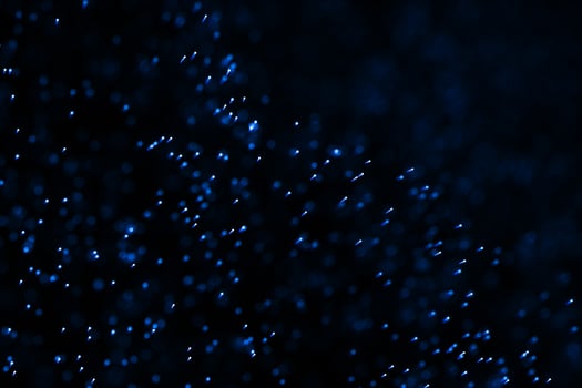 Flowing and glowing particles with dark background, 3d rendering photo