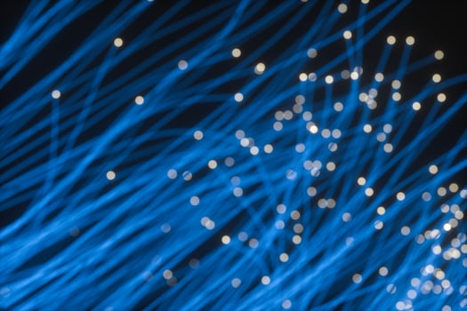 Flowing and glowing particles with dark background, 3d rendering photo