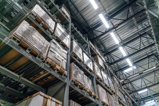 The warehouse full of goods, boxes and shelves photo