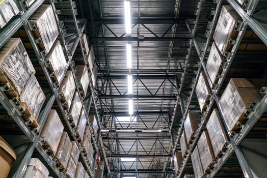 The warehouse full of goods, boxes and shelves photo