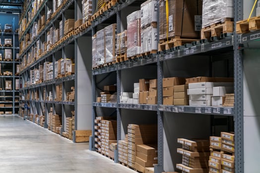 The warehouse full of goods, boxes and shelves photo