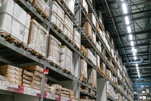 The warehouse full of goods, boxes and shelves photo