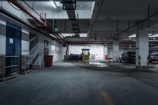 old parking lot with lighting, concrete building photo