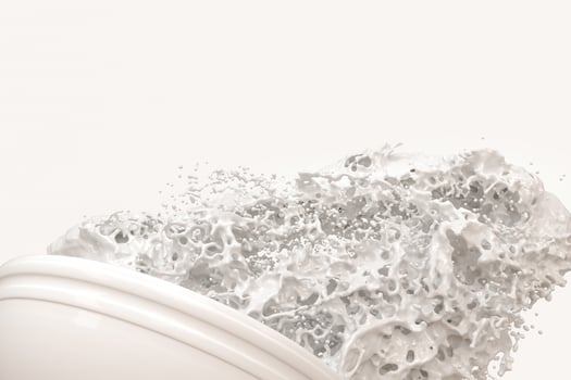 A bowl of milk and splashing liquid, 3d rendering. photo