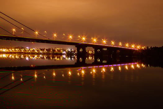 night city with reflection of houses in the river photo