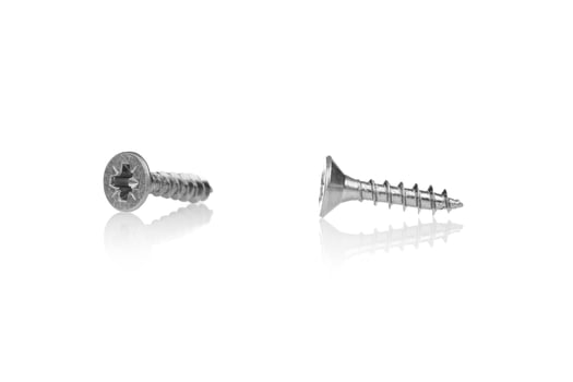 macro screw of silver color on a white background photo