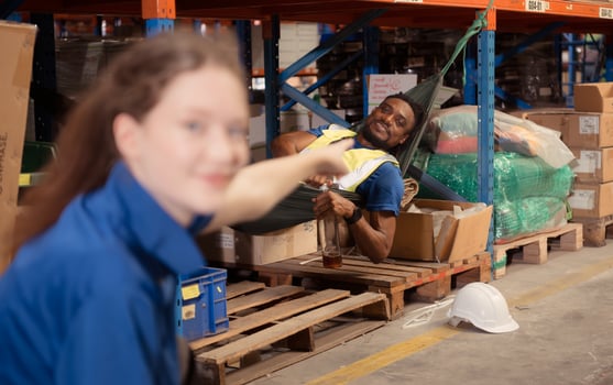 Portrait of happy mature African American man working in warehouse. This is a freight transportation and distribution warehouse. Industrial and industrial workers concept photo