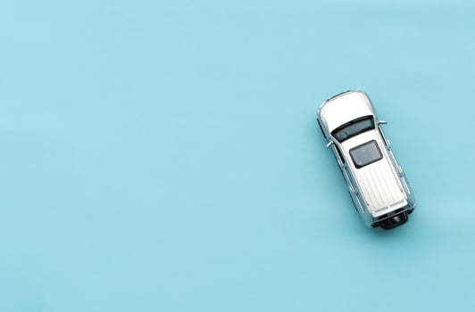 Car model isolated on blue background, after some edits. photo