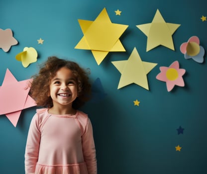 Girl with star stickers on blue background photo