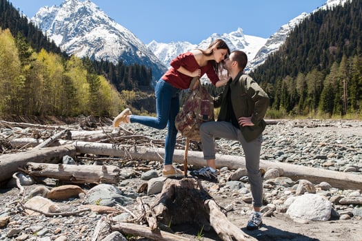 young hipster couple in love on winter vacation in mountains photo