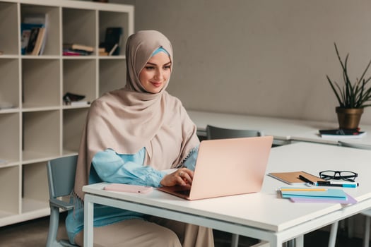 modern muslim woman in hijab in office room photo