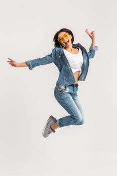 attractive smiling happy woman active jumping photo