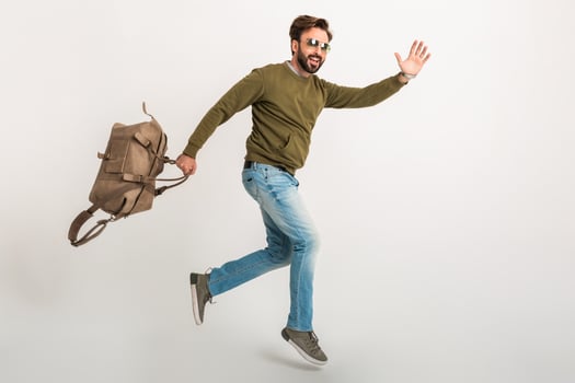 handsome bearded stylish man jumping running photo