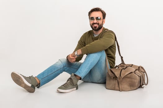 hansome bearded stylish man sitting on floor photo