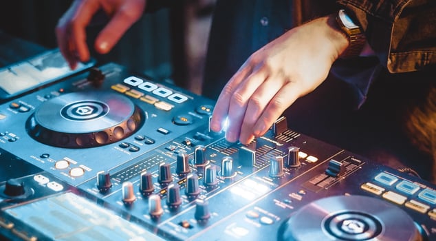 Dj performance with electronic music in the night club photo