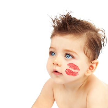 Baby boy with kiss photo