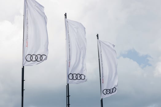 Minsk, Belarus, August 2023 - White flags with Audo logo photo