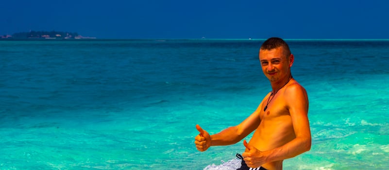 Male model tourist on island Madivaru Finolhu Rasdhoo Atoll Maldives. photo
