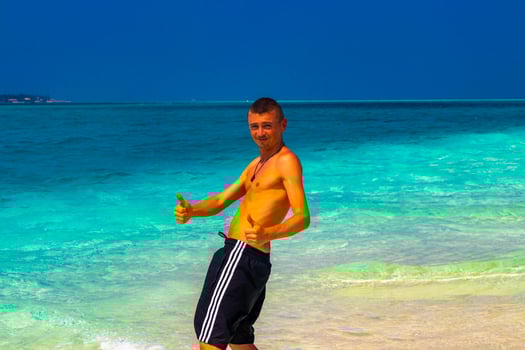 Male model tourist on island Madivaru Finolhu Rasdhoo Atoll Maldives. photo