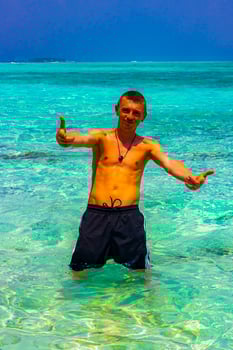Male model tourist on island Madivaru Finolhu Rasdhoo Atoll Maldives. photo