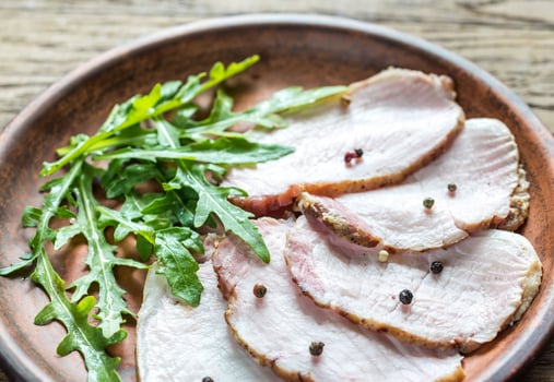 Baked meat with fresh rocket salad photo
