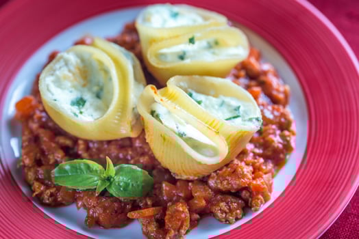 Lumaconi stuffed with ricotta with bolognese sauce photo